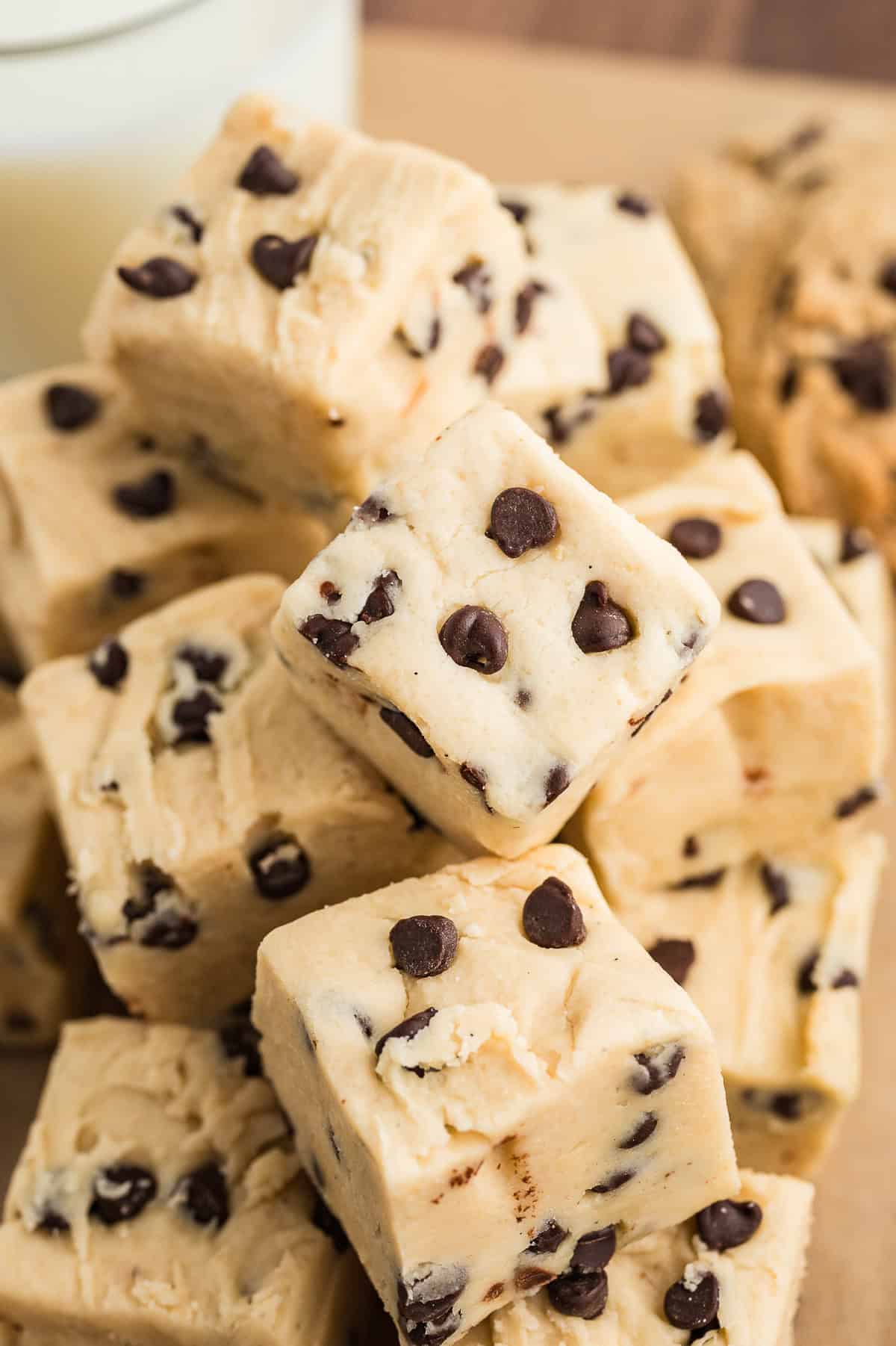 Cookie dough fudge all stacked together on counter.