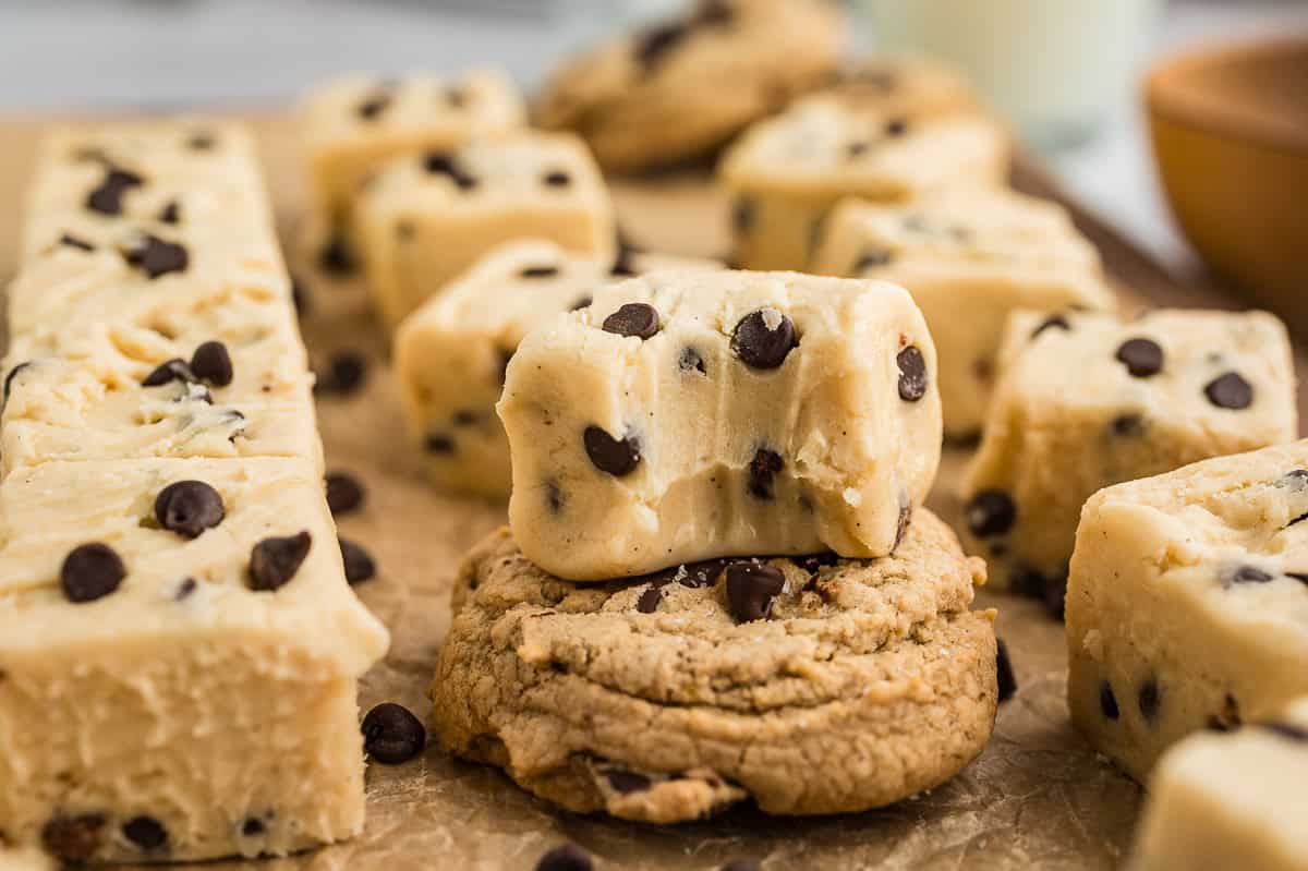 Small pieces chocolate chip fudge piled on a plate.