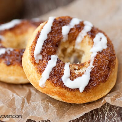 A close up of two cinnamon roll donuts