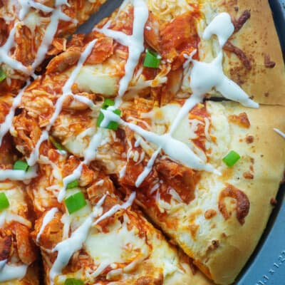 overhead view of sliced buffalo chicken pizza.