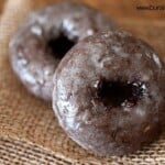 A close up of a chocolate doughnut