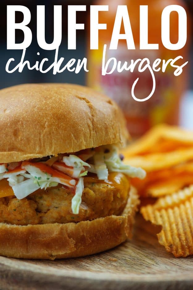 buffalo chicken burgers on cutting board with chips