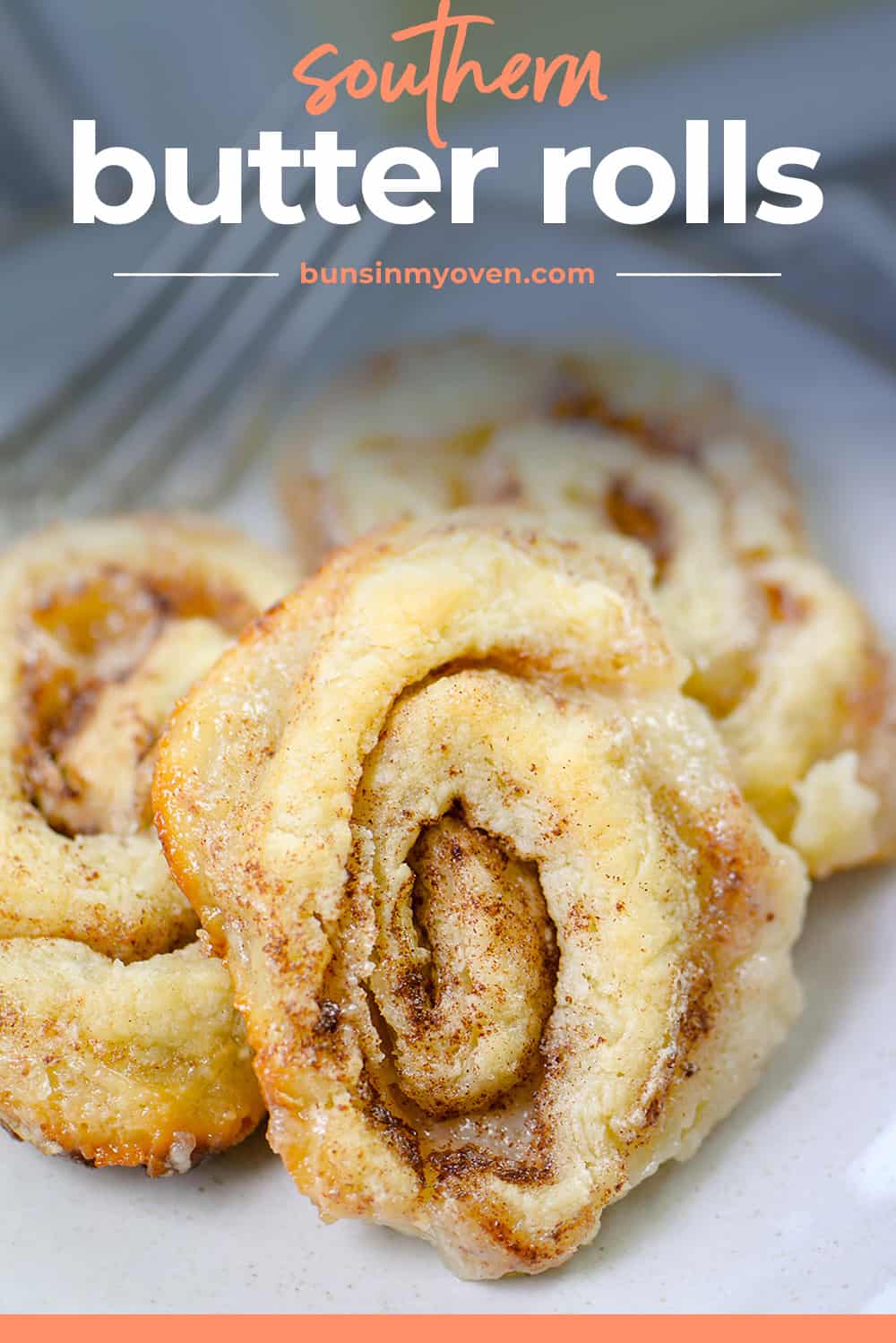 Southern butter rolls on white plate.