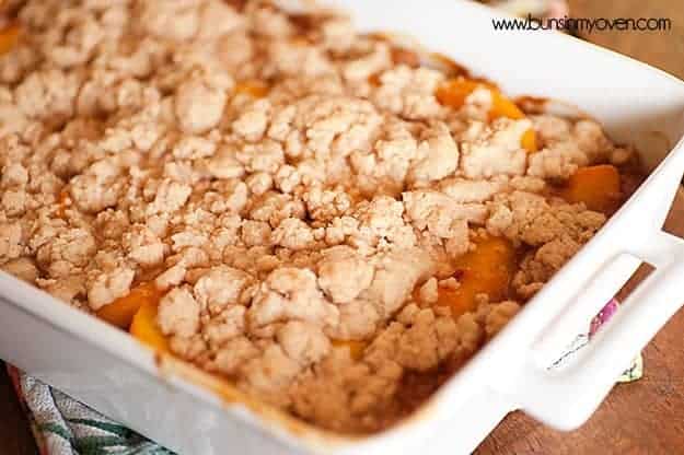 A whtie pan of peach cobbler