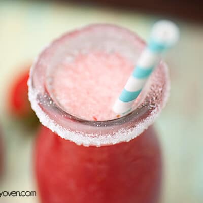 A small glass jar of watermelon spritzer.