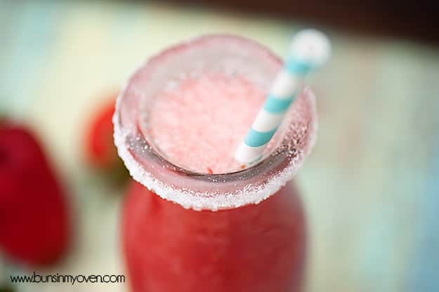 A small glass jar of watermelon spritzer.