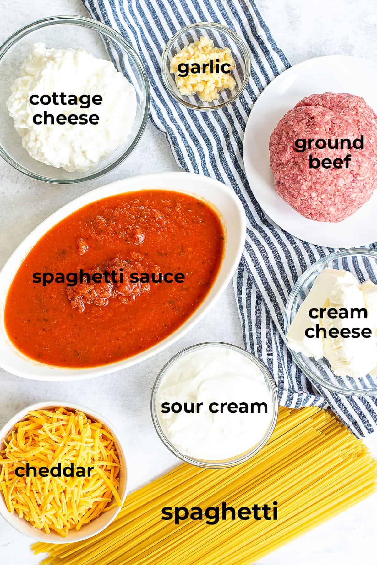 ingredients for creamy baked spaghetti laid out on counter.