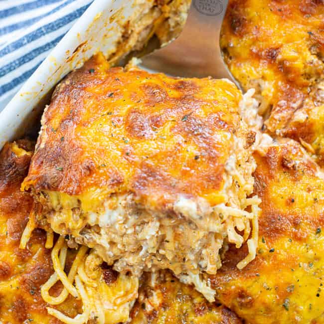 creamy baked spaghetti in baking dish.