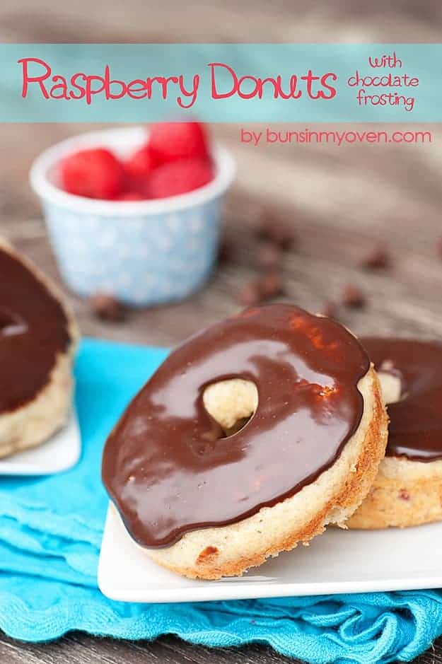 A close up of two donuts on a white plate