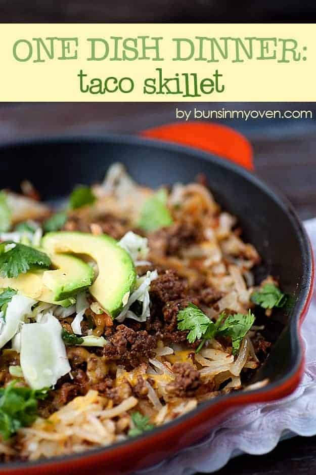 Taco filling in a cast iron skillet topped with avocado.