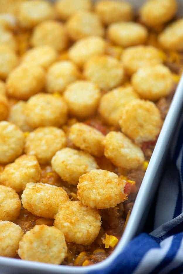 tater tots in a white baking dish.