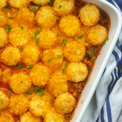 tater tot casserole in white dish.