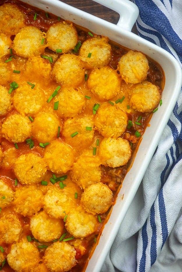 tater tot casserole in white dish.