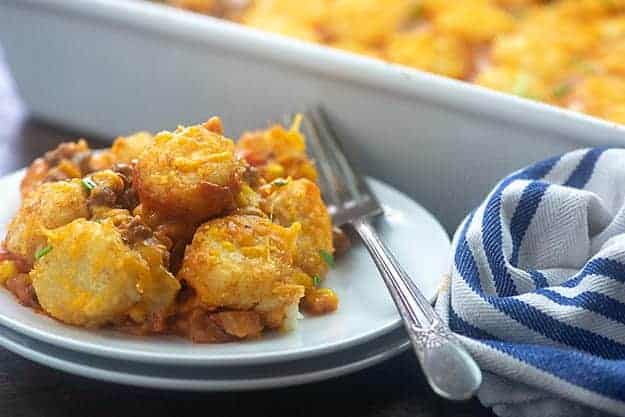 small plate of tater tots in front of a white baking pan.