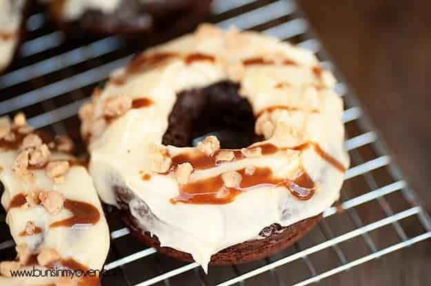 A closeup of an overhead view of a toffee crunch donut 