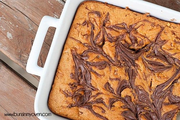 Overhead view of pumpkin nutella bars in a white baking pan.
