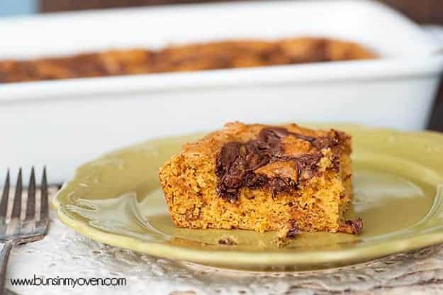 A close up of a pumpkin bar on a decorative plate.