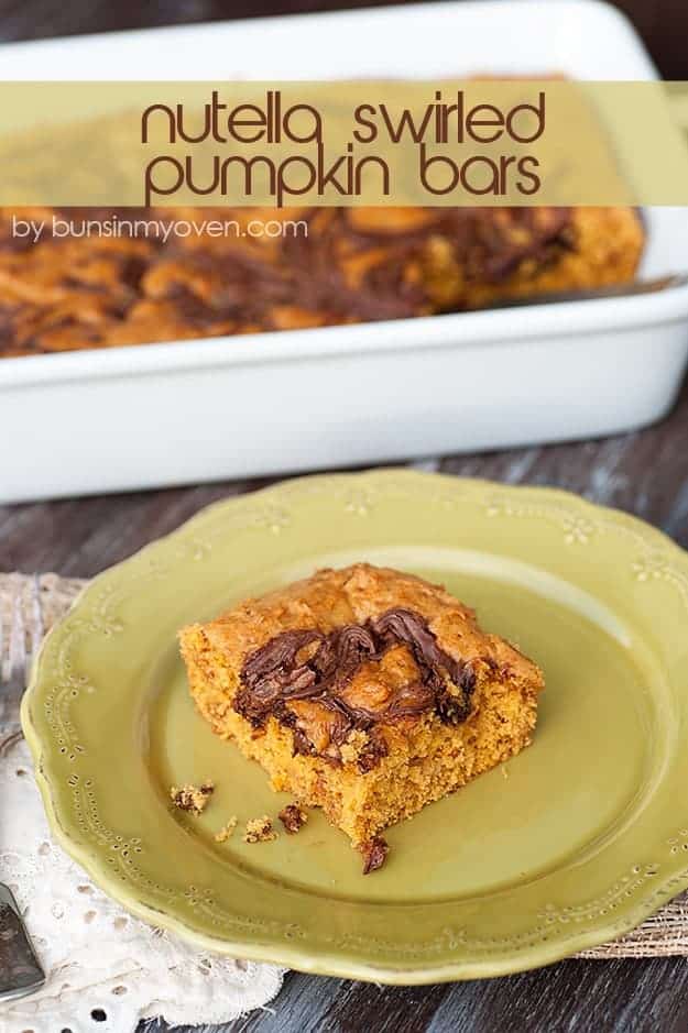 A square of pumpkin bar topped with Nutella on a decorative plate