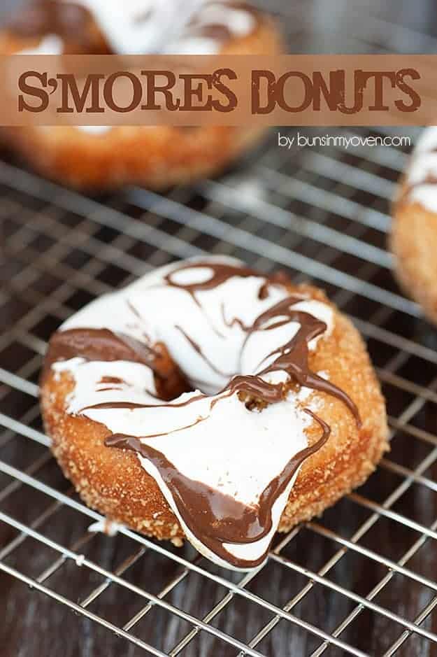 A donut with white and chocolate frosting on a cooling rack.