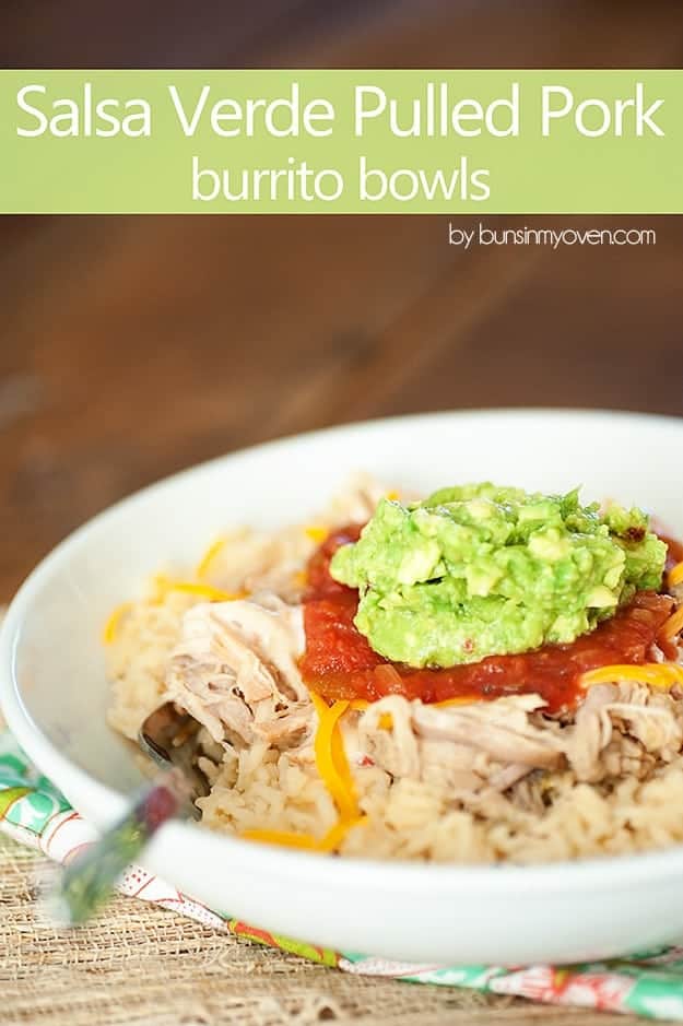 A bowl of pulled pork topped with salsa on a table.