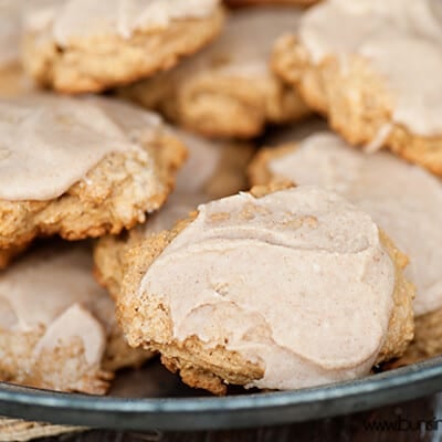 A close up of cookies topped with brown butter glaze icing.