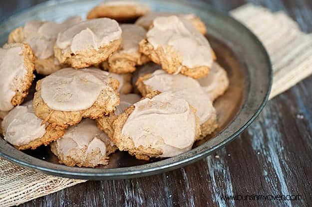 A pile of sweet potato cookies with brown butter glaze on them.
