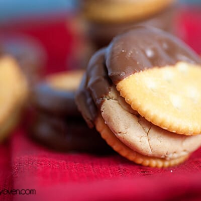 A close up of a Ritz sandwich that was dipped into chocolate.