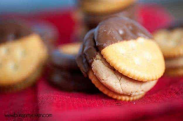 A close up of a Ritz sandwich that was dipped into chocolate.