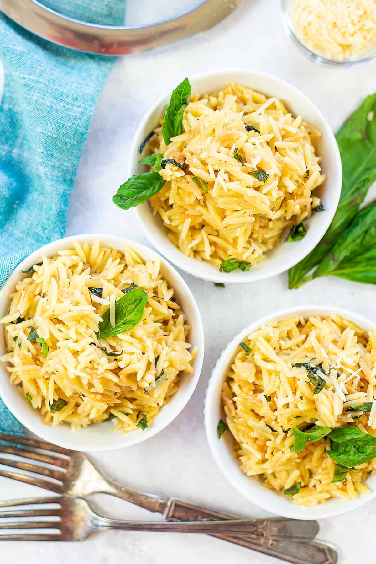 overhead view of bowls full of orzo pasta.