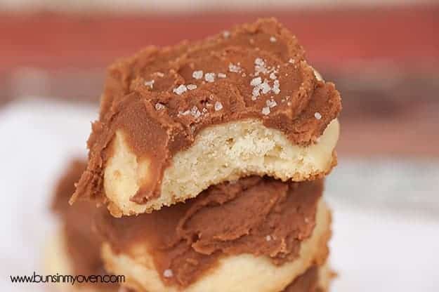 A close up of a piece of chocolate frosted shortbread.