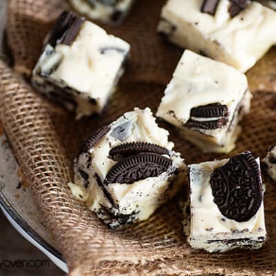 A close up of several pieces of Oreo fudge on a woven napkin.