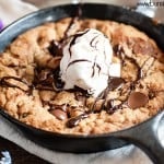 A skillet cookie topped with ice cream.