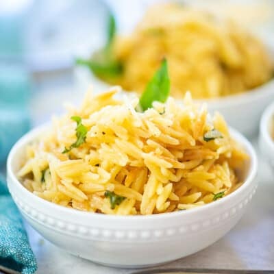 Parmesan orzo in white bowl.