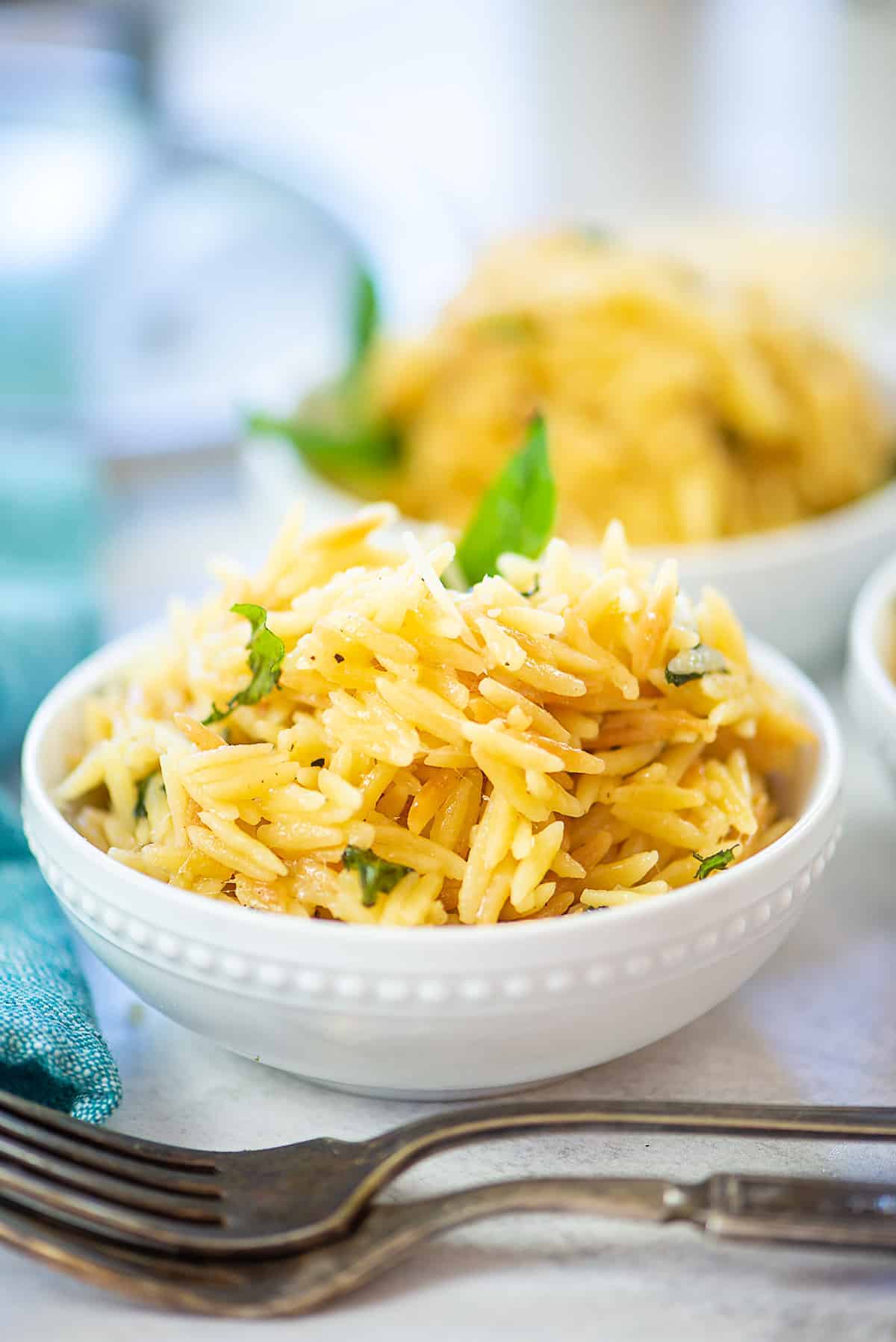 Parmesan orzo in white bowl.