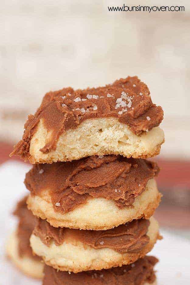 A stack of chocolate frosted shortbread cookies.