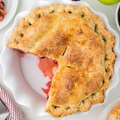 Apple cranberry pie in pie plate.