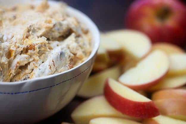 cream cheese fruit dip in bowl with apples