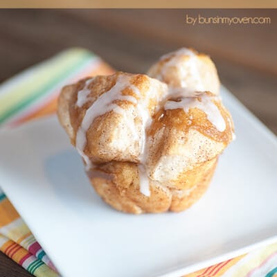 A monkey bread muffin on a square white plate.