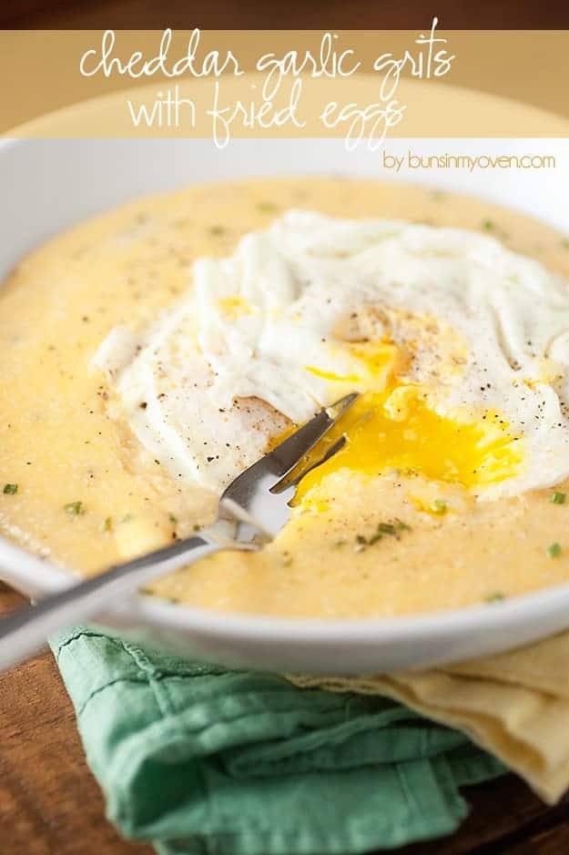 A bowl of grits topped with a fried egg.