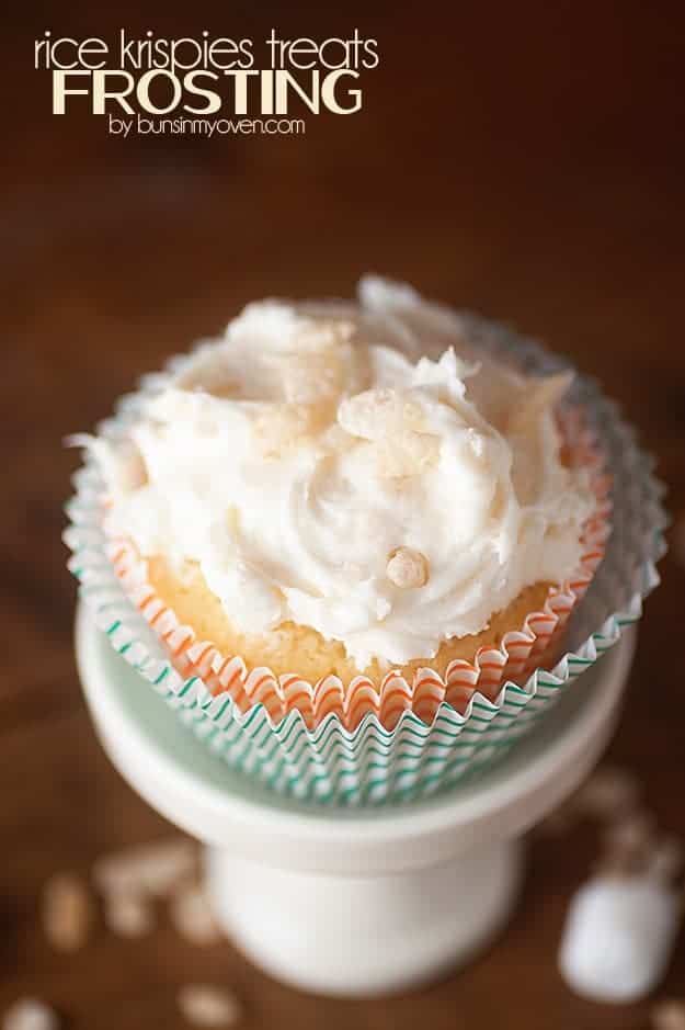 An overhead view of a decorated cupcake on a white cupcake stand.