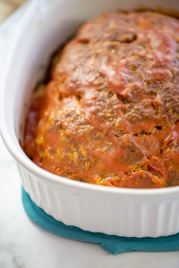 bacon cheeseburger meatloaf in white baking dish.