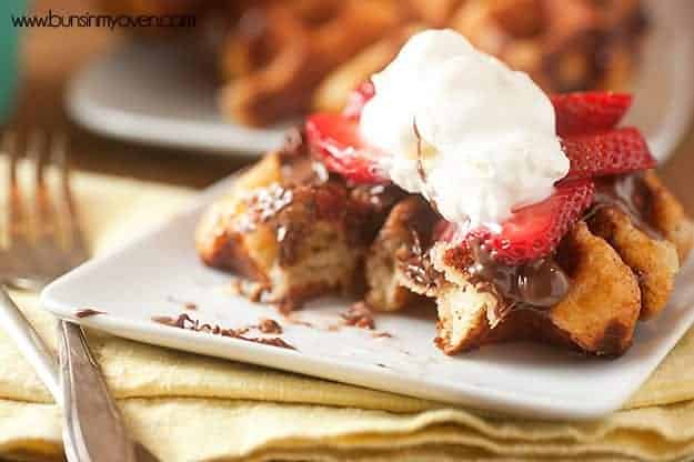 Loaded with chunks of sugar, these liege waffles are SO not your typical breakfast waffle! Topped with Nutella and strawberries!