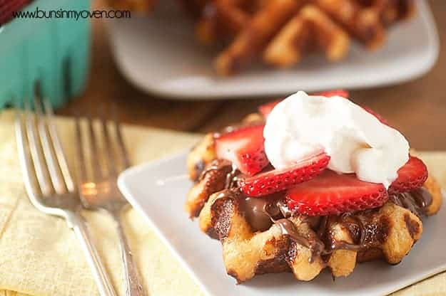 Loaded with chunks of sugar, these liege waffles are SO not your typical breakfast waffle! Topped with Nutella and strawberries!