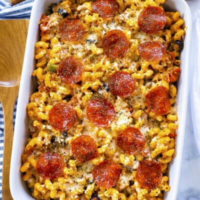 Overhead view of pizza pasta in white baking dish.