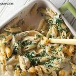 Pasta and spinach artichoke dip in a nine by thirteen baking dish