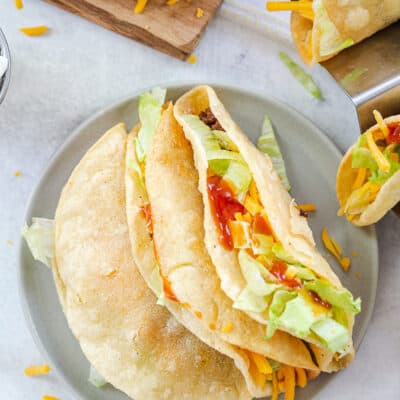 fried tacos on small plate.