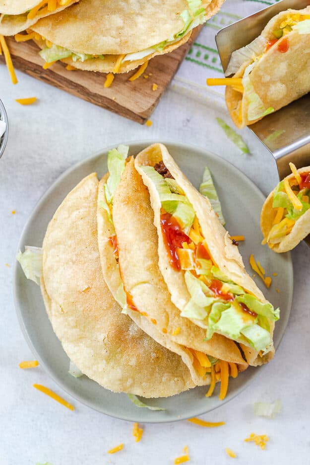 fried tacos on small plate.