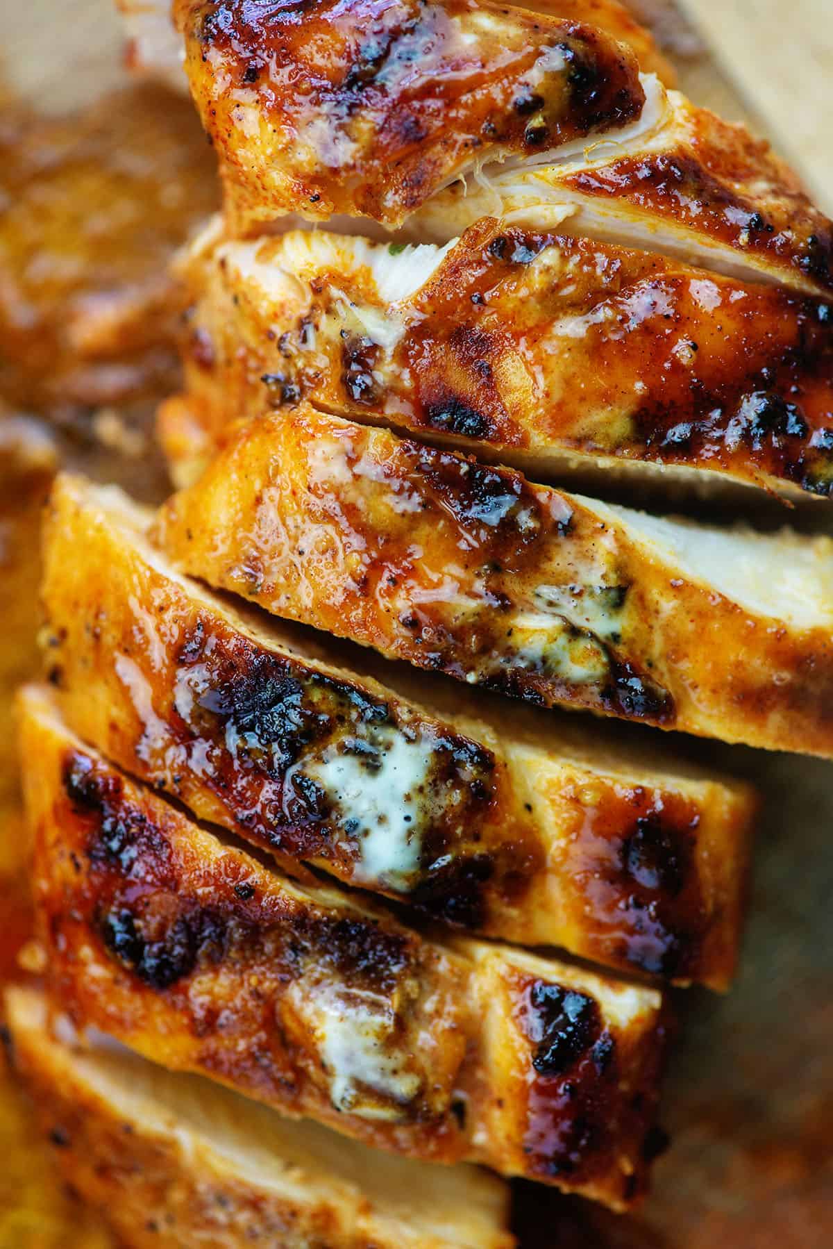 alabama white grilled chicken on cutting board.