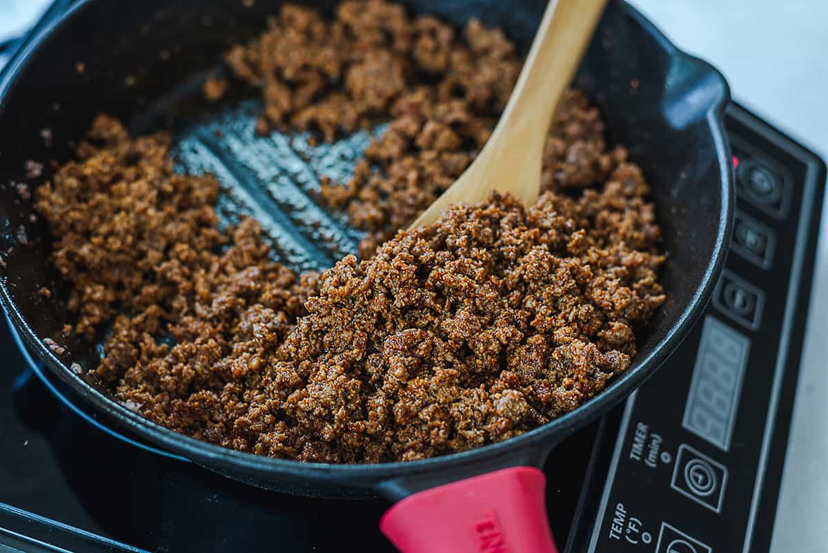 seasoned taco meat in skillet.