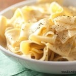 Seasoned egg noodles in a white bowl.